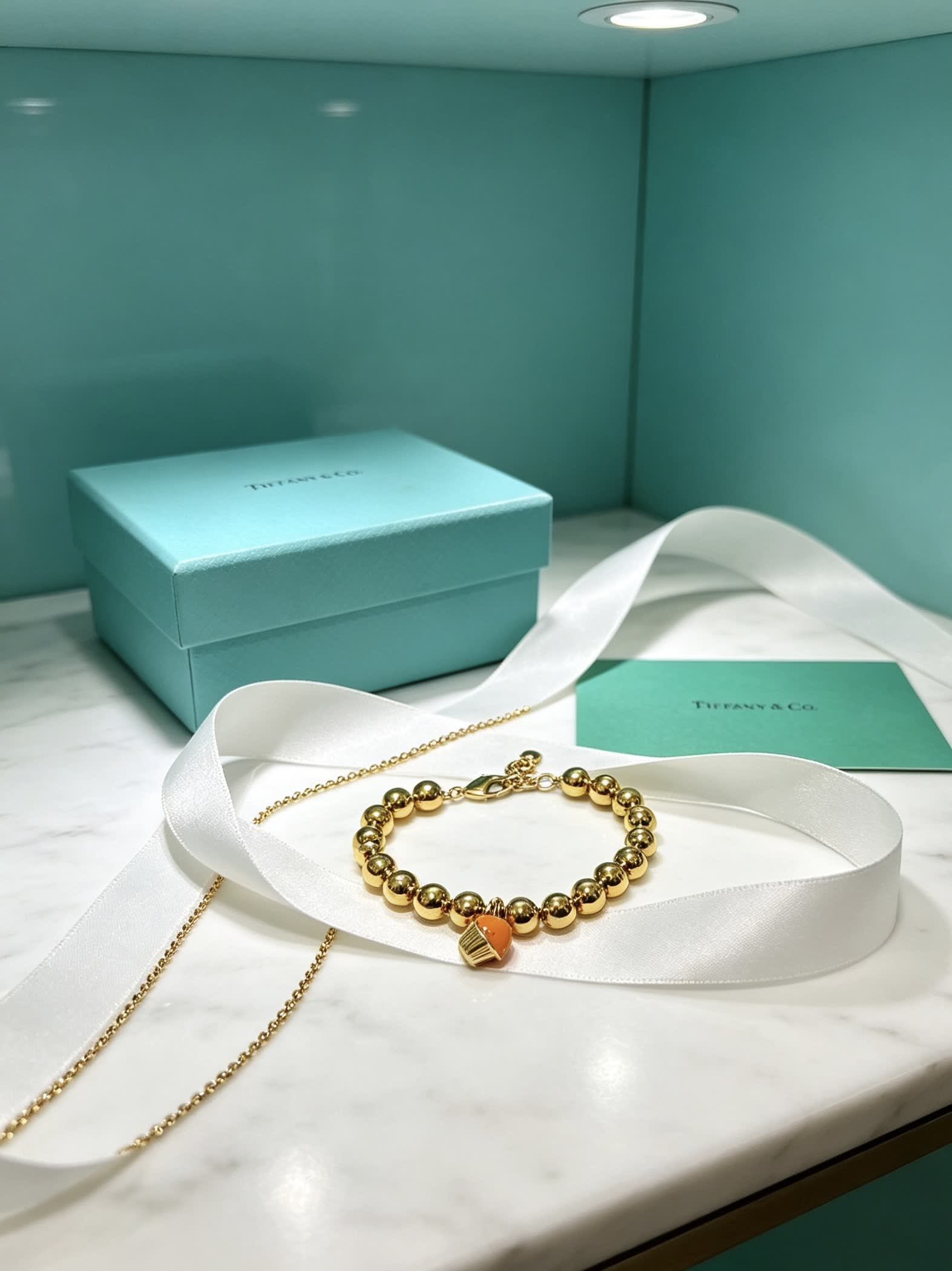 Tiffany & Co. Gold Bead Bracelet with Cupcake Charm